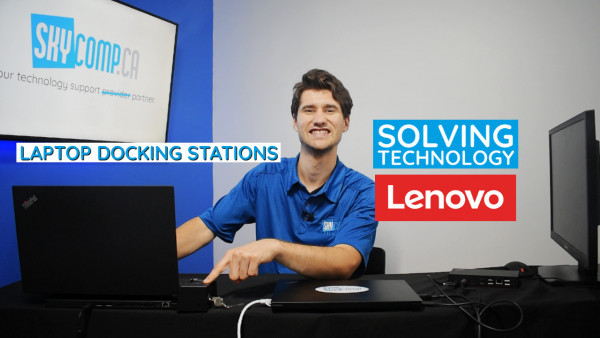 Sebastian from Skycomp beside a laptop and Lenovo docking station with Lenovo logo and title Solving technology - Lenovo Docking Stations