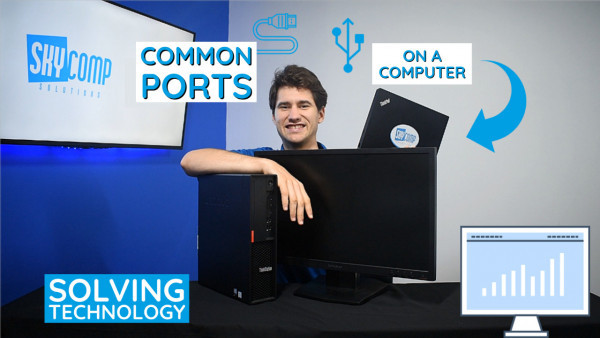 Sebastian from Skycomp Solutions pictured with a PC with title Common Ports on a Computer