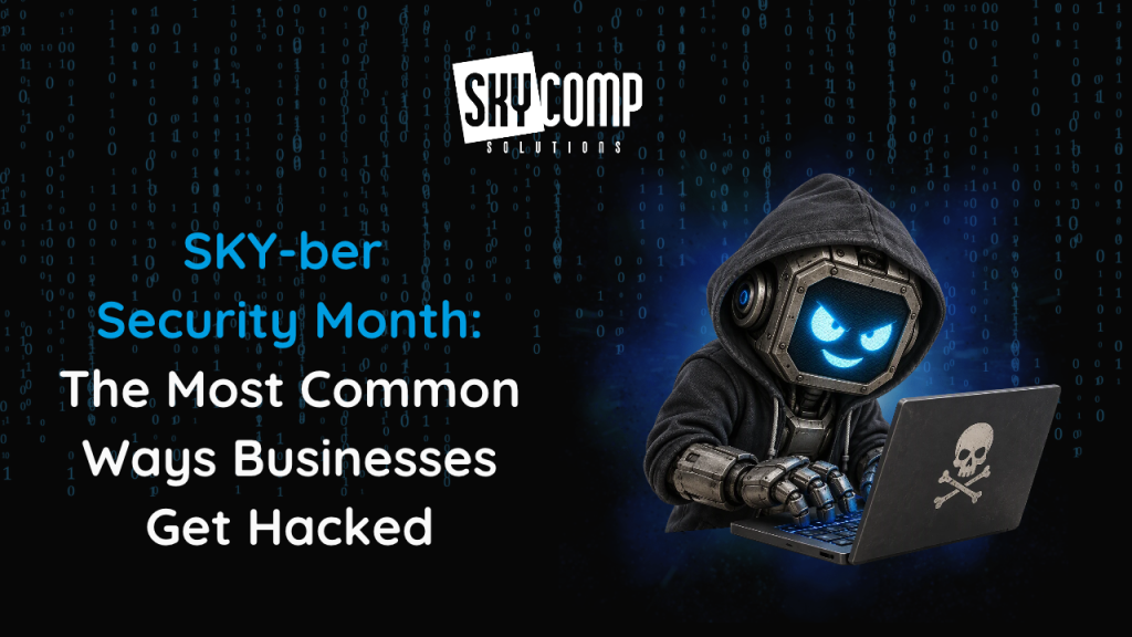 Promotional banner for SkyComp Solutions about Security Month: blue headline on the left, and a hooded cyber hacker at a laptop with a skull logo on the right.